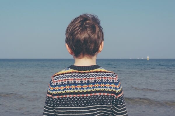 Boy looking at water